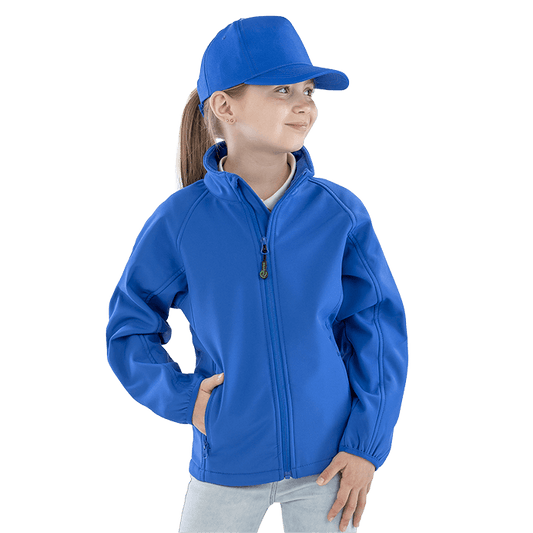 Model wearing the Result Recycled Junior Softshell Jacket in Royal Blue, front view, worn by a girl in a cap