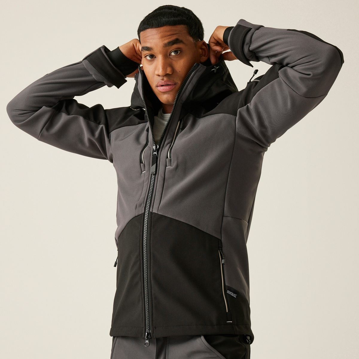 Model wearing the Regatta 4TEX Men's Stretch 3-Layer Softshell Jacket in Slate Grey and Black, front view