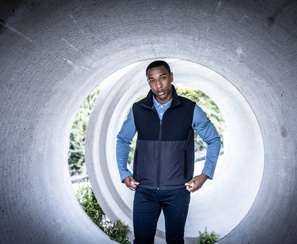 Man wearing the Regatta Recycle.Me Thermal Bodywarmer in Black, standing in a concrete pipe