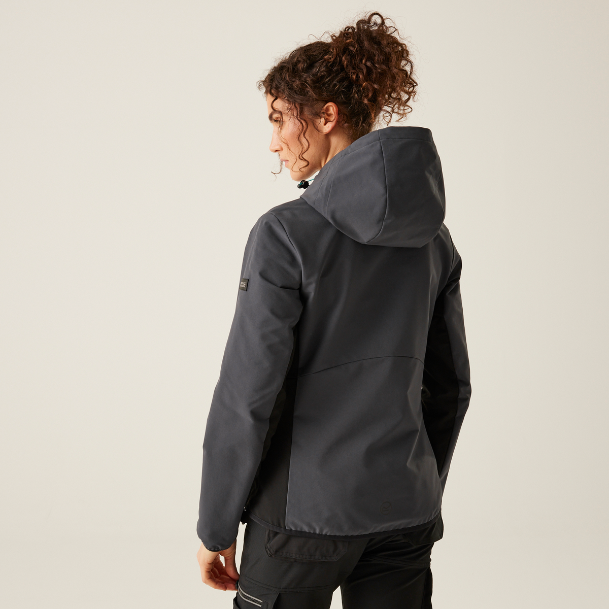 Model wearing the Regatta Ada Ladies Stretch Softshell Jacket in Seal Grey and Black, back view