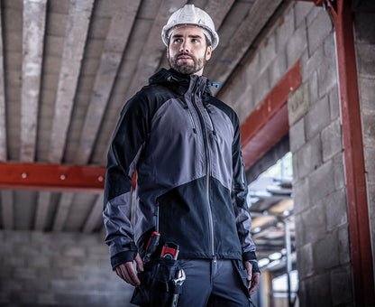 Man in a hard hat wearing the Regatta 4TEX Men's Stretch Waterproof Shell Jacket, on a building site