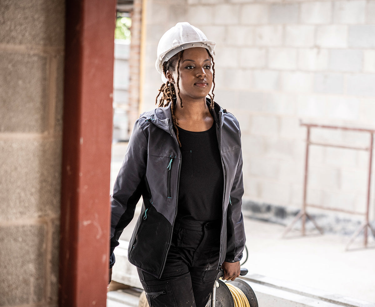 Woman in a hard hat wearing the Regatta Ada Ladies Stretch Softshell Jacket, on a building site