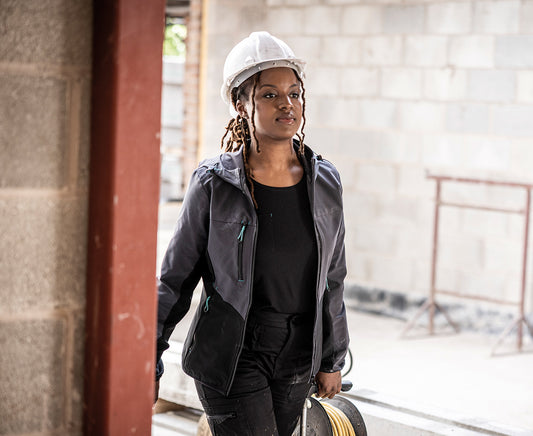 Woman in a hard hat wearing the Regatta Ada Ladies Stretch Softshell Jacket, on a building site