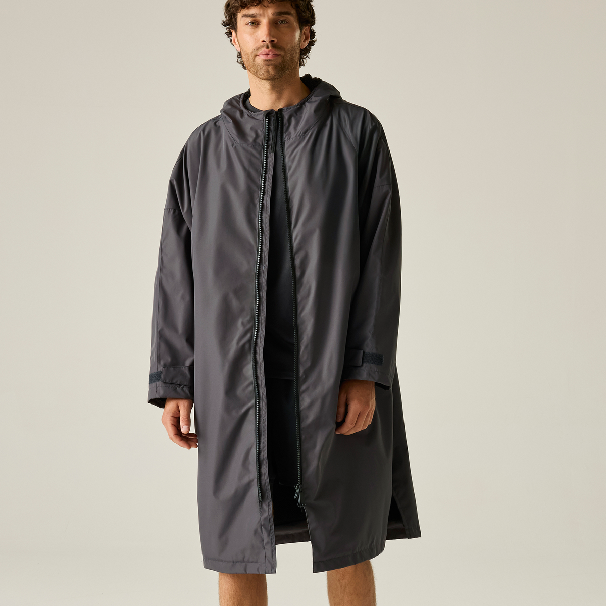 Model wearing the Regatta Pro Changing Dryrobe Jacket in Slate Grey and Black, front view