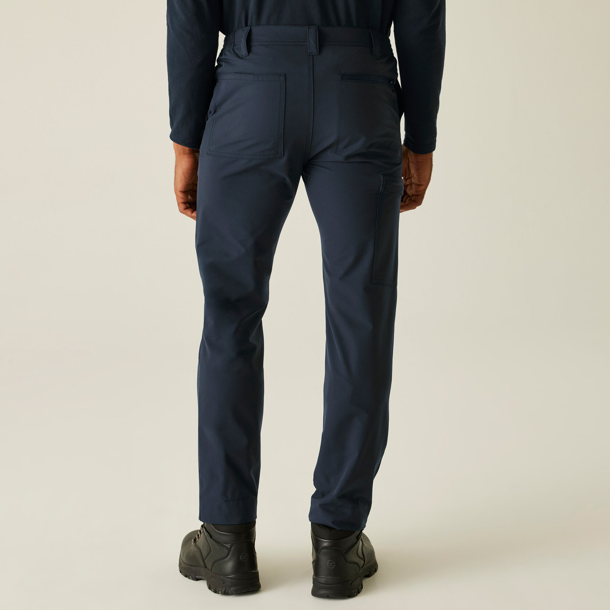 Model wearing the Regatta Pro Men’s Action Stretch Trousers in Navy, back view