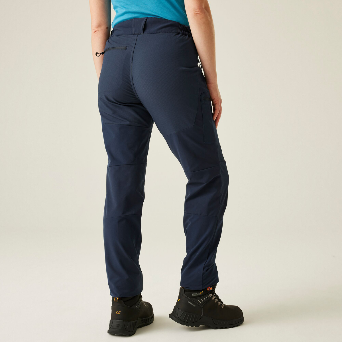 Model wearing the Regatta Prolite Ladies Stretch Trousers in Navy, back view