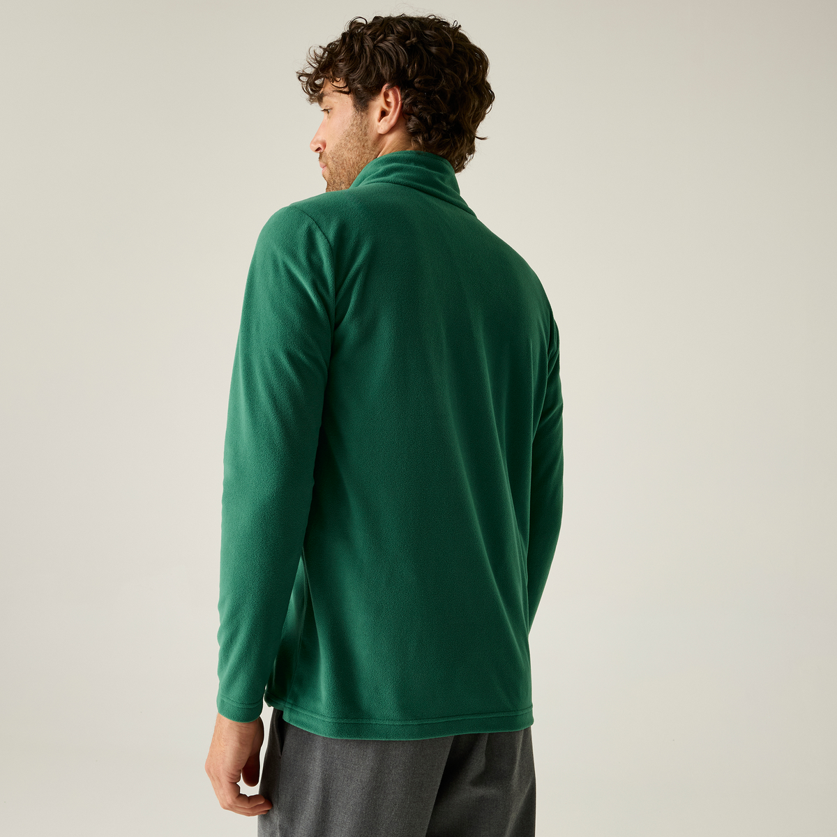 Model wearing the Regatta Pro Men’s Ultra Light Fleece Jacket in Bottle Green, back view