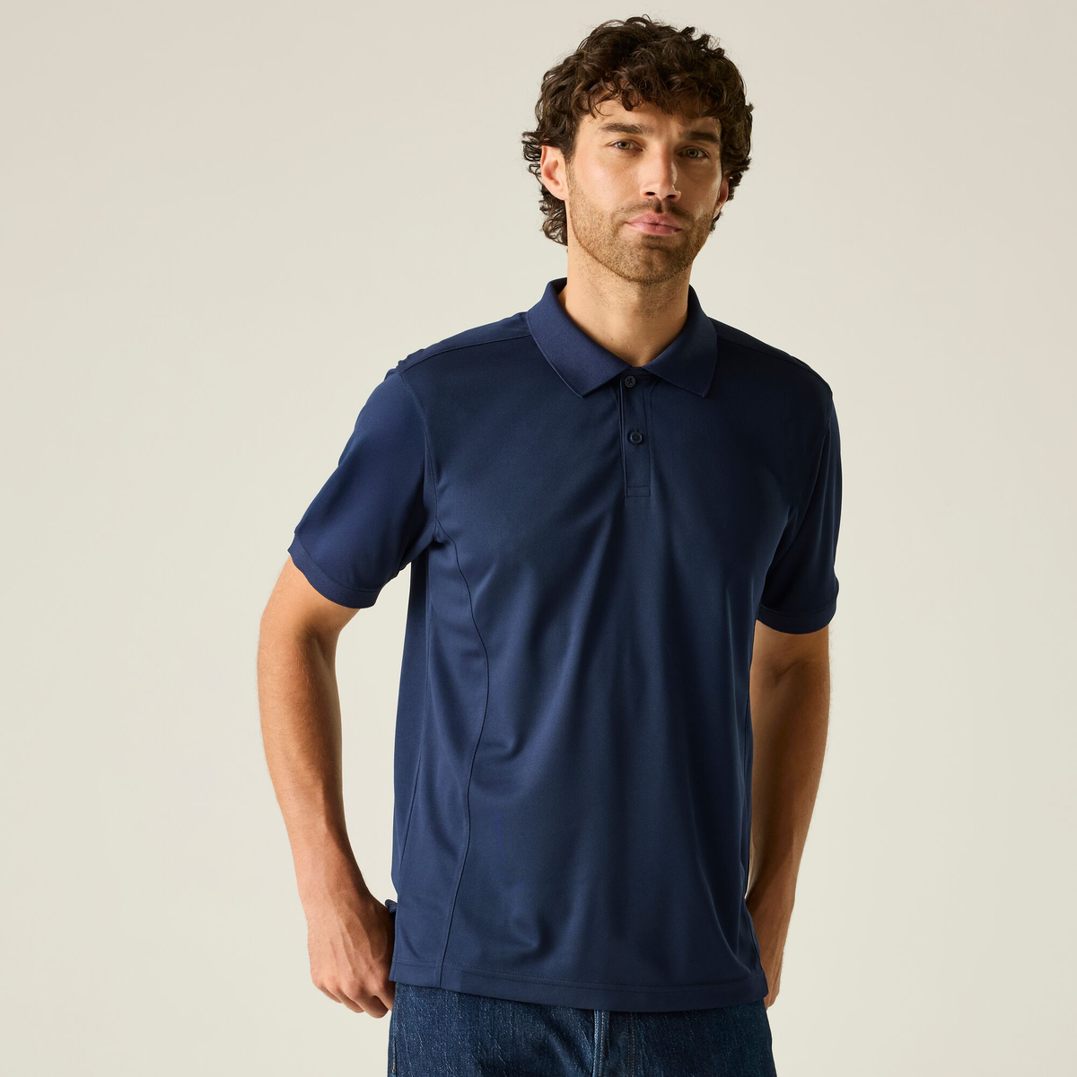 Model wearing the Regatta Recycle.Me Unisex Pique Polo Shirt in Navy, front view