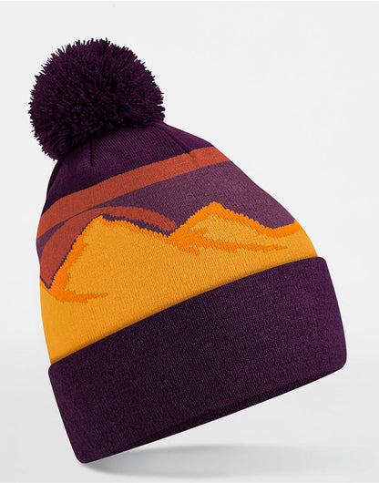 Beechfield Mountain Peaks Pom Pom Beanie in Desert Peaks, three-quarter view