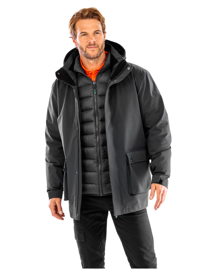 Model wearing the Result Recycled 3-In-1 Padded Jacket in Black, front view, unzipped, showing the inner jacket