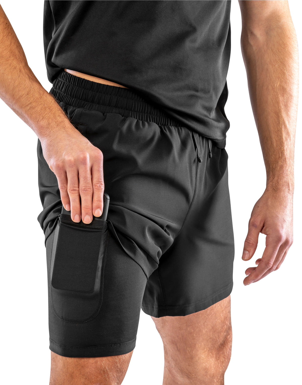 Model wearing the Spiro Recycled Men’s Shorts in Black, close-up, putting a phone in the leg pocket