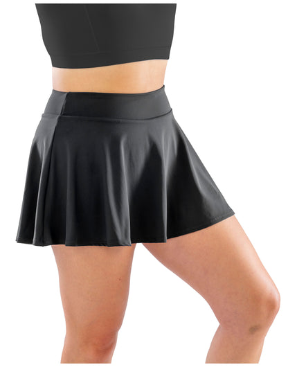 Model wearing the Spiro Recycled Ladies Fitness Skort in Black, side view