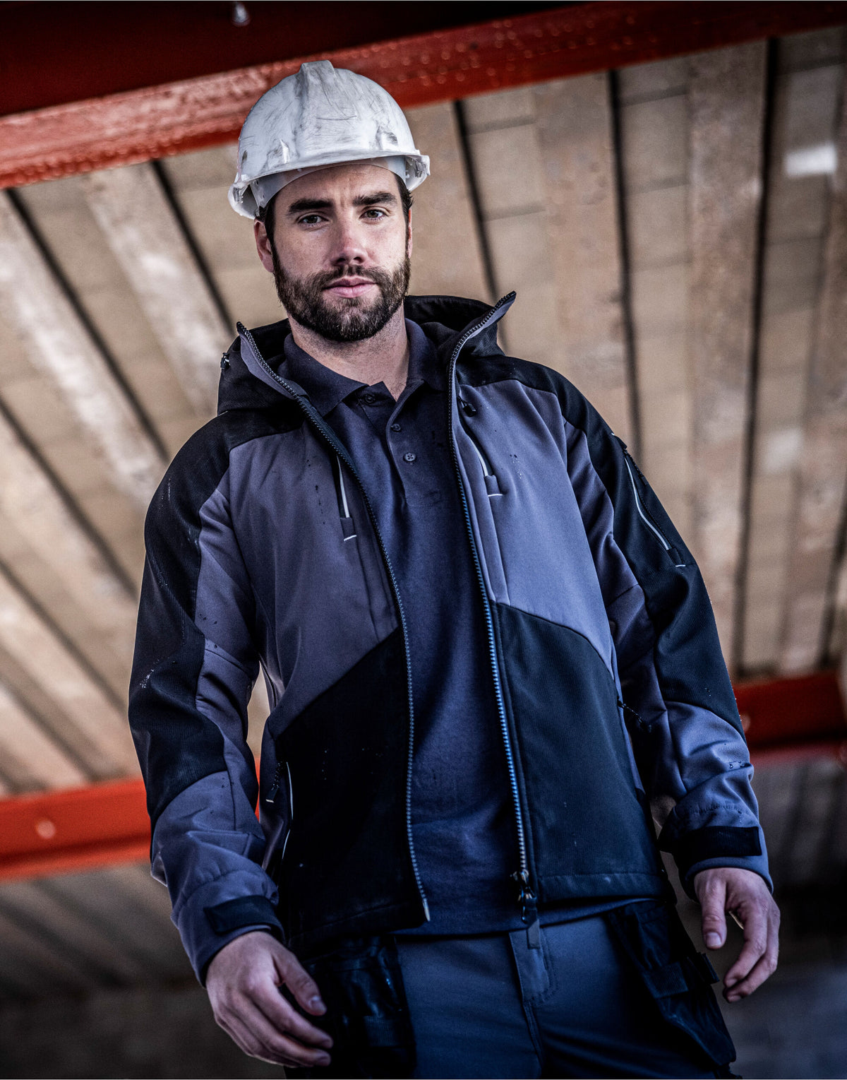 Man in a hard hat wearing the Regatta 4TEX Men's Stretch 3-Layer Softshell Jacket, on a building site