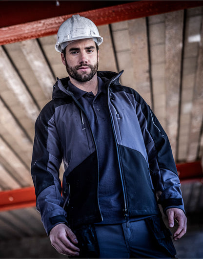 Man in a hard hat wearing the Regatta 4TEX Men's Stretch 3-Layer Softshell Jacket, on a building site