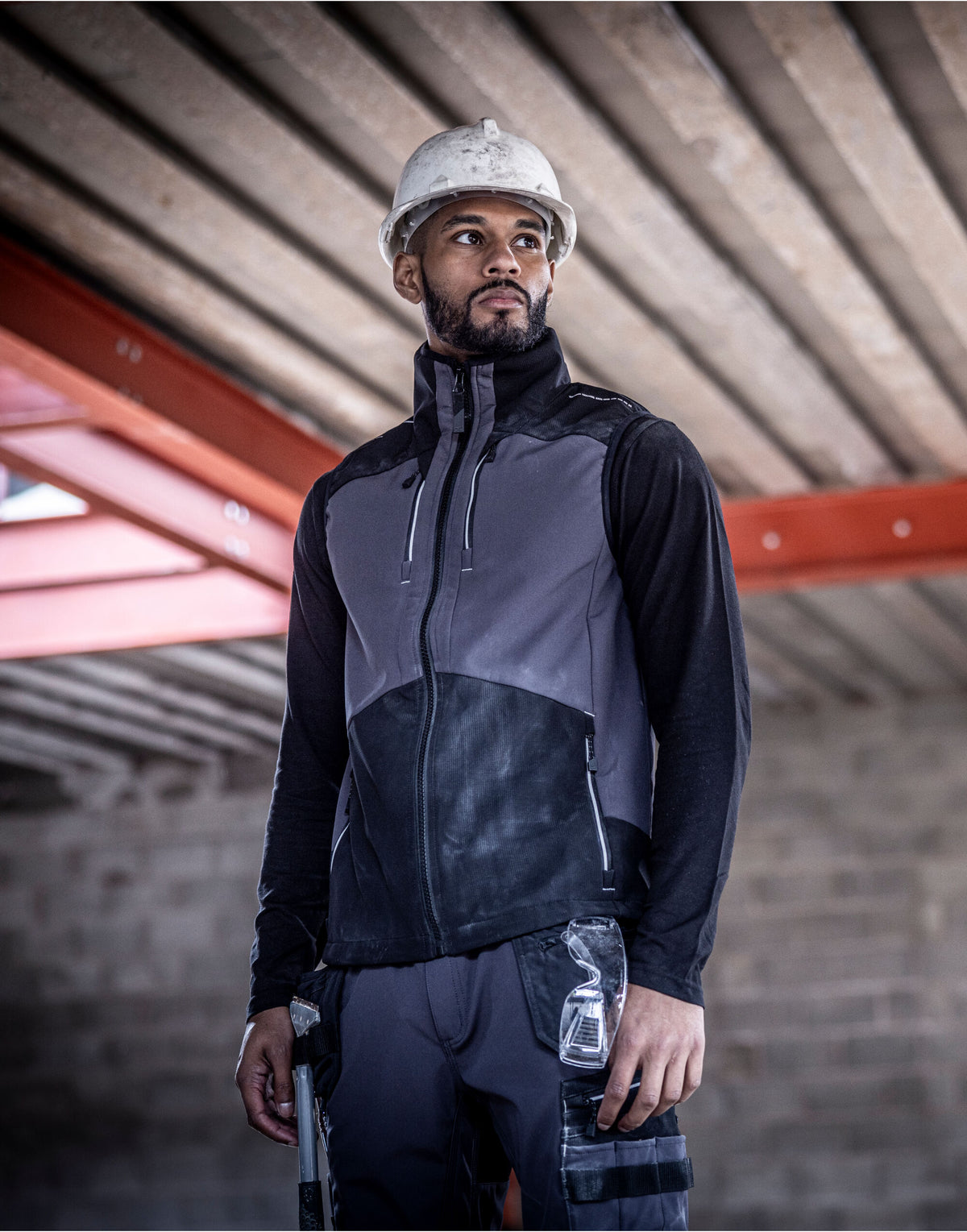 Man in a hard hat wearing the Regatta 4TEX Men's Stretch 3-Layer Softshell Bodywarmer, on a building site