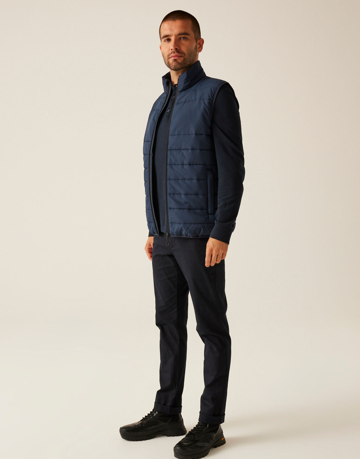 Model wearing the Regatta Essential Men's Thermal Bodywarmer in Navy, side view, full length