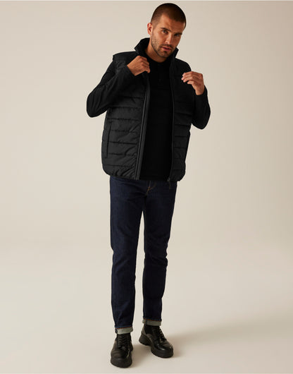 Model wearing the Regatta Essential Men's Thermal Bodywarmer in Black, front view, full length, adjusting the collar
