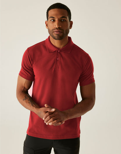 Model wearing the Regatta Pro Men’s 50/50 Pique Polo Shirt in Red, front view