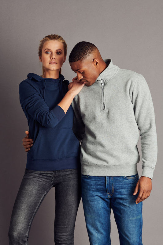 Man wearing the James Harvest Rounders Half-Zip Sweatshirt in Grey Melange beside a woman in a navy hoodie